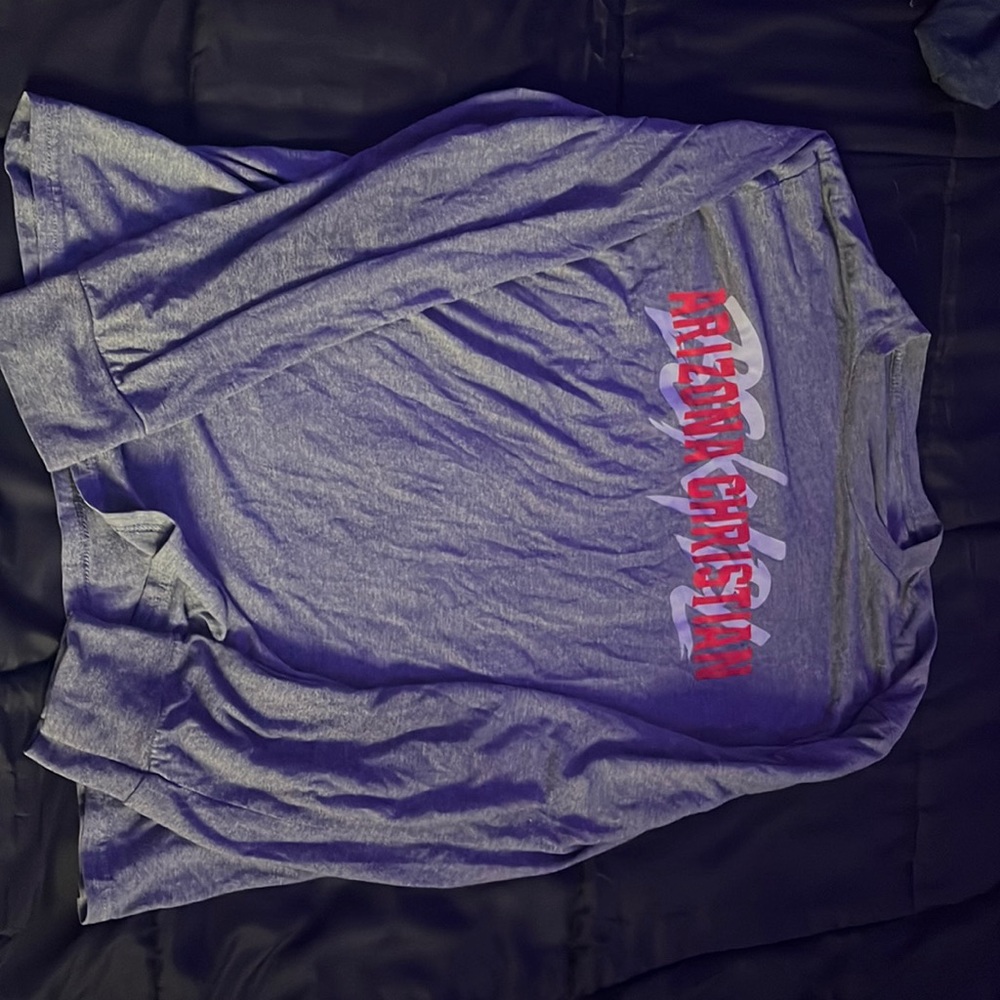 I am selling a long sleeve grey t-shirt with the words Arizona Christian writte